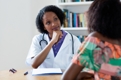 photo of nurse listening to patient