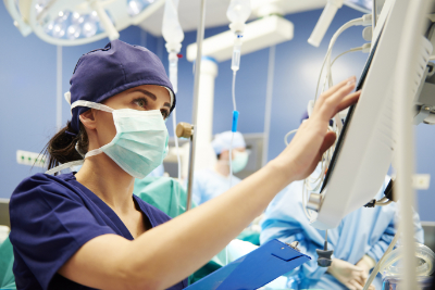 photo of nurse caring for patient during surgery