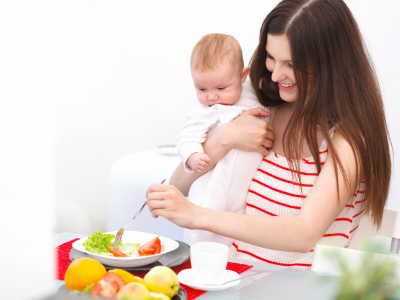 mother and baby fixing food