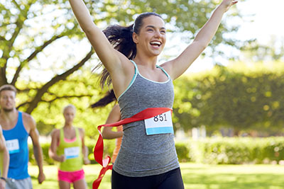 photo of runner crossing the finish line